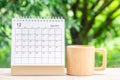 December month, Calendar desk 2021 for organizer to planning and reminder on wooden table with green nature background Royalty Free Stock Photo