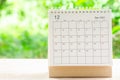 December month, Calendar desk 2021 for organizer to planning and reminder on wooden table with green nature background Royalty Free Stock Photo