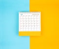 December 2023, Monthly desk calendar for 2023 year on blue and yellow background