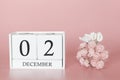 December 02nd. Day 2 of month. Calendar cube on modern pink background, concept of bussines and an importent event