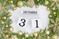 31 december perpetual calendar. Happy new year greeting card design Green frame made of Christmas trees and golden Royalty Free Stock Photo