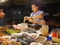 29 december 2016 phnom penh cambodia, woman on night market working editorial