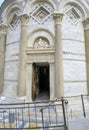 December 2022 Pisa, Italy: Entrance and door of the leaning tower of Pisa closeup. Travel to Tuscany, Italy. Royalty Free Stock Photo