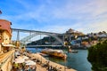 10 of December, 2018 - Porto, Portugal: View of the historic city with the Dom Luiz bridge. A metro train can be seen on the Royalty Free Stock Photo