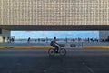 December 2019, Recife, Brazil. A young men is biking along the empty street