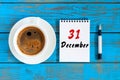 December 31st. Day 31 of month, calendar on wooden desk background. New year at work concept. Winter time Royalty Free Stock Photo