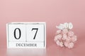 December 07th. Day 7 of month. Calendar cube on modern pink background, concept of bussines and an importent event