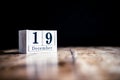 December 19th, 19 December, Nineteenth of December - White block calendar on vintage table - Date on dark background Royalty Free Stock Photo