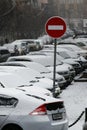 Highway with parked cars during a snowfall Royalty Free Stock Photo