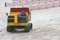 2018 December 08. Wakayama Japan. a yellow komatsu tractor car parking at Shirahama beach to prepare for next worksite