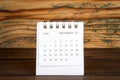 2020 DECEMBER. White paper calendar on a wooden table. Time planning Royalty Free Stock Photo
