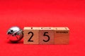 25 December on wooden blocks with a silver bell Royalty Free Stock Photo