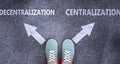 Decentralization and centralization as different choices in life - pictured as words Decentralization, centralization on a road to