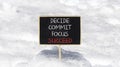 Decide commit focus succeed symbol. Concept word Decide Commit Focus Succeed on beautiful blackboard. Beautiful white snow