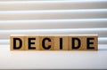Decide word on wooden cubes Royalty Free Stock Photo