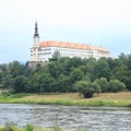 Decin palace with tower on rocky cliff