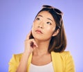 Decision, idea and asian woman with wonder or choice with purple background in studio with glasses. Contemplating, girl