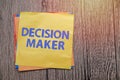 Decision Maker, text words typography written on paper against wooden background, life and business motivational inspirational Royalty Free Stock Photo