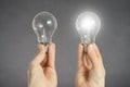 Decision making concept, hands with light bulbs Royalty Free Stock Photo