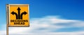 Decisions Ahead Road Sign against a Blurred Clear Sky with Clouds Royalty Free Stock Photo