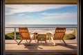 deck of a beach house with chairs looking out to the sea Royalty Free Stock Photo