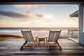 deck of a beach house with chairs looking out to the sea Royalty Free Stock Photo