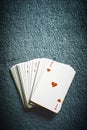 A deck of cards on a dark gray table, ace of hearts first, top view with copy space Royalty Free Stock Photo