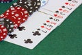 A deck of cards laid out on a green background