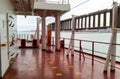 The deck of a cargo ship. Red floor and white