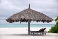 Deck chair and big umbrella at beach Royalty Free Stock Photo