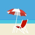 Deck chair and umbrella on the background of the sea and white sand on the beach. Royalty Free Stock Photo