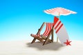 Deck chair under an umbrella and a surfboard on sandy beach Royalty Free Stock Photo