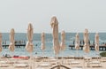 Deck chairs and parasols on the sandy beach in Portoroz, Slovenia