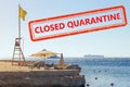 Deck chairs, umbrella, lifeguard tower on the Red Sea. Stamp with a red inscription Closed Quarantine