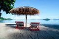 Deck chairs and umbrella on tropical beach scenery. Koh Mark Thailand