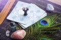 Deck with divination homemade Angel cards on black table, surrounded with semi precious stones crystals.