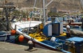 A deck hand works on a local fishing trawler berthed in the crowded harbor in Los Cristianos in Spanish Island of Teneriffe