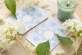 Deck with homemade divination Angel cards on wood table with hydrangea flower for decoration.