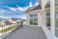 Deck of a house with stairs, wood flooring, and metal railings