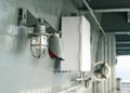 Deck lamp on ship in protective cage Royalty Free Stock Photo