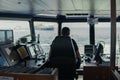 Deck navigation officer on the navigation bridge. He looks to sea