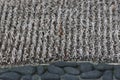 Outdoor doormat carpet fibers closeup of thick bristles