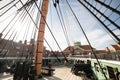 The deck of a tall ship HMS Trincomalee with masts, planks and rigging