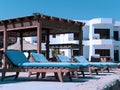 Deckchairs with blue sponges in hotel Royalty Free Stock Photo