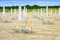 Deckchairs in a italian seaside with sand dunes in the background Royalty Free Stock Photo
