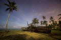 Deckchairs under the thatched roof on a beach, a tourist destination in Terengganu, Malaysia. Clean sandy beach with blue sea and