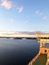 Decks and cabins on the side of cruiseship. Wing of running bridge of cruise liner. White cruise ship on a blue sky with radar Royalty Free Stock Photo