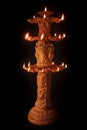 A declarative multi facing three stage standing Earthen Oil Lamp or Diya