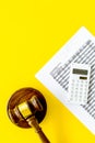 Declare bankruptcy concept. Judge gavel, financial documents, calculator on yellow background top view copy space