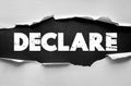 DECLARE text presented with torn paper effect background. Symbolic image representing official statement, announcement, Royalty Free Stock Photo